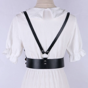 Detailed back view of a black faux leather corset harness belt with silver metal ring rings