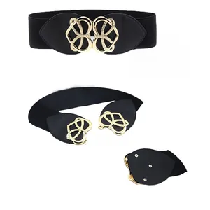Close-up of black elastic waist belt with a golden hollow buckle for women's dresses