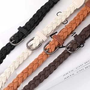 Set of four woven waist belts in black, cream, and brown with vintage metal buckles
