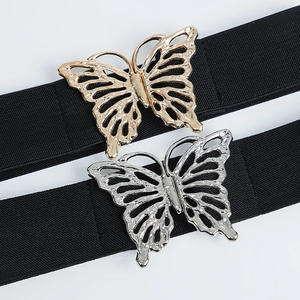Ceinture large élastique avec boucle papillon ajourée en finition dorée et argentée