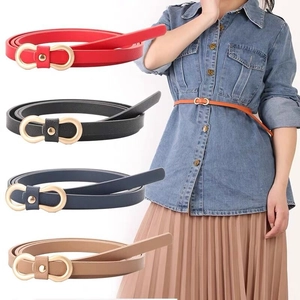 Detailed view of narrow PU leather belts in five colors with matte gold metal buckle