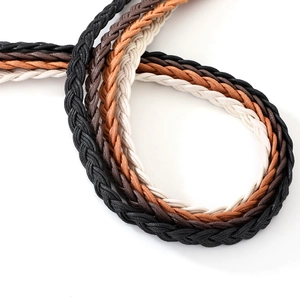 Close-up of four colors braided skinny waist belts showing woven texture and wax rope detail