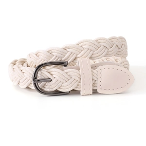 Detail of cream white braided waist belt with textured wax rope and metal D-ring buckle