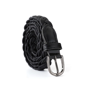 Detail of black braided rope belt with silver metallic pin buckle and leather patch