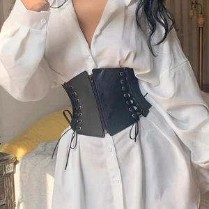 Women punk wide corset belt with front zipper and lace-up details over a white shirt