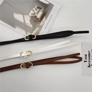 Three minimalist women's narrow PU leather belts in black, white and brown with gold buckles