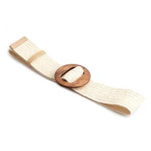 Detail of bohemian woven elastic belt featuring a round dark brown wooden buckle