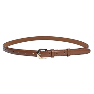 Detail of slim brown leather belt with gold horseshoe buckle and fine stitching