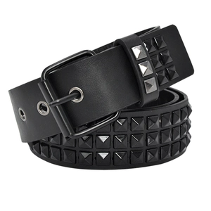 Close-up of black punk belt with three rows of silver and black pyramid studs