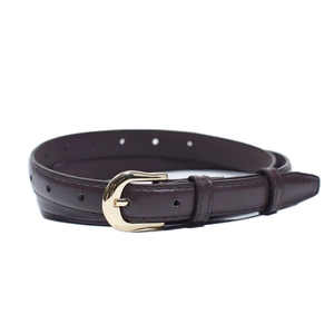 Close-up of thin dark brown leather belt with gold oval buckle and fine edge stitching