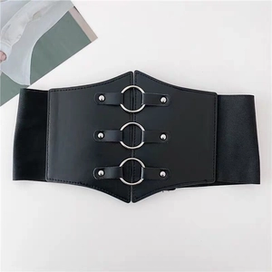 Wide black elastic waist belt for women with silver metal rings and punk rivet details
