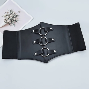 Detail of black elastic corset belt with three silver metal rings and metallic rivets