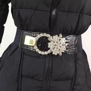 Elegant wide elastic black waist belt featuring a luxury rhinestone flower buckle for coats