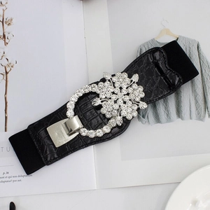 Women's black elastic waist belt with silver floral rhinestone buckle and crocodile texture