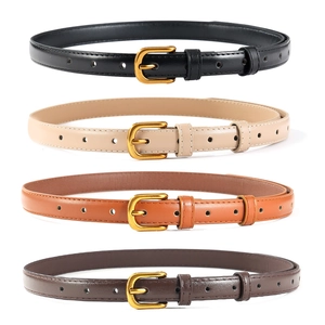 Détail de quatre ceintures fines en cuir noir, beige, fauve et marron avec boucles dorées