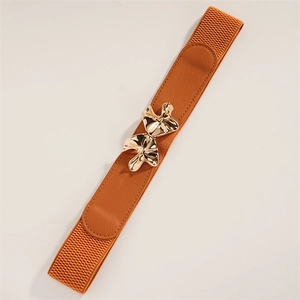Detail view of camel elastic belt featuring elegant golden mushroom shaped metal buckle