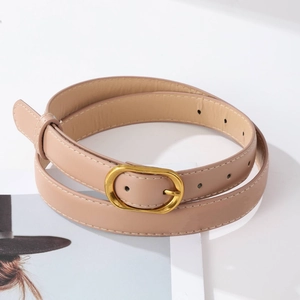 Close-up of beige leather belt with vintage golden buckle and neat stitching detail