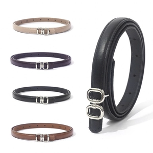 Slim women's leather belts in four colors with silver double-ring buckles on white background