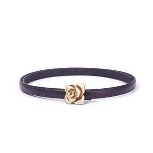 Detail of slim leather belt featuring a 3D gold rose buckle and deep purple finish