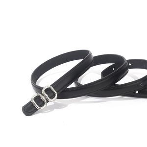 Black thin leather belt for women with elegant silver double ring metal buckle on white background