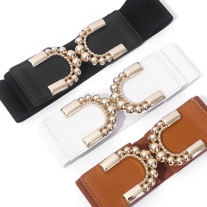 Lot de trois ceintures élastiques en noir, blanc et marron avec boucle dorée élégante