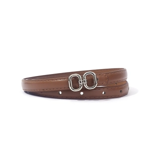 Detail view of a slim brown leather belt with a polished silver double-ring buckle