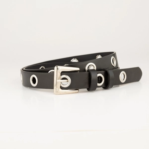 Close-up of black punk belt with silver eyelets and a classic metal pin buckle detail