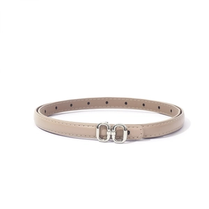 Detailed macro view of beige PU leather belt with silver double ring buckle and fine stitching