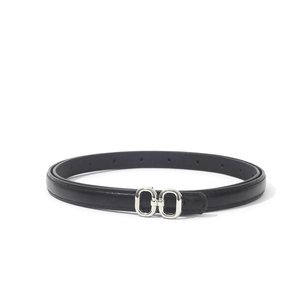 Detail of slim black PU leather belt featuring dual oval silver metal buckle and stitching