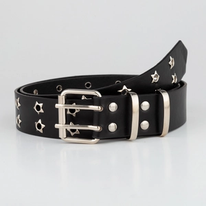 Detail of black punk leather belt featuring star-shaped silver eyelets and double pin buckle