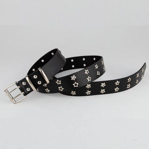 Detail of black punk leather belt featuring double rows of silver star eyelets and prong buckle