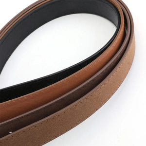 Macro view showing high-quality suede and smooth leather belts with fine stitching details