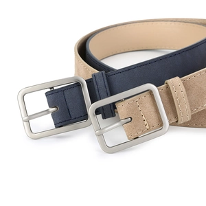 Detailed macro view of retro matte leather belts with silver square metal buckles