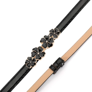 Close-up of black patent leather skinny belt with golden enamel plum blossom buckle