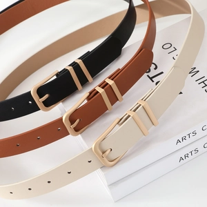 Three minimalist slim leather belts for women with matte gold pin buckles in black and brown