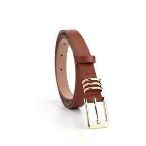 Close-up of brown faux leather skinny belt with golden rectangular buckle and rings