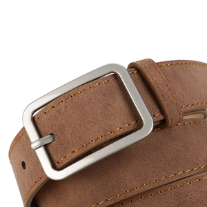 Detail shot of a brown matte suede belt featuring a silver metal square buckle and orange stitching