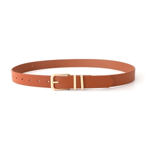 Detail view of brown leather belt featuring a classic gold buckle and double metal rings