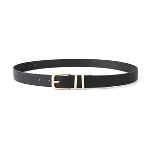 Detail of minimalist black leather belt featuring dual gold rings and a polished pin buckle