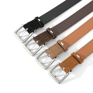 Detail view of suede belts in black, chocolate, camel, and caramel with silver buckles