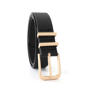 Close-up of black leather belt featuring double gold loops and a polished metal buckle