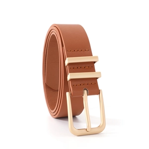 Detail of a brown leather belt with a golden buckle and double metal loops