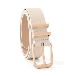 Detailed macro view of cream faux leather belt with a matte gold rectangular buckle