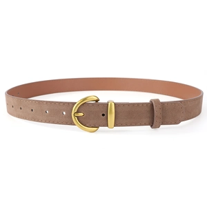 Detail of vintage brown suede belt with matte gold horseshoe buckle for women