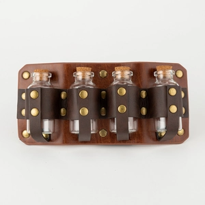 Detail view of four glass alchemy vials in a vintage embossed brown leather belt holster