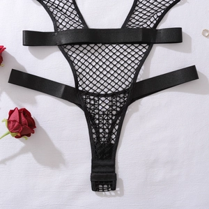 Detail of black hollow out fishnet bodysuit featuring triple snap closure and satin straps