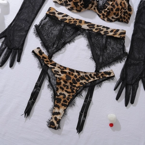 Detail of leopard print lace lingerie set with mesh gloves and garter belt set
