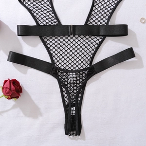Flat lay of black fishnet bodysuit with straps and label showing 95% polyester material