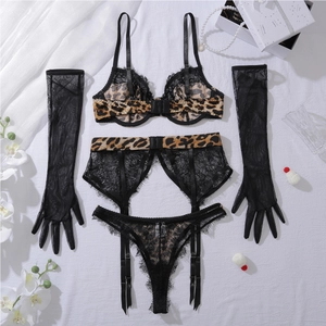 Detail view of leopard print lace lingerie set with matching sheer gloves and garter belt