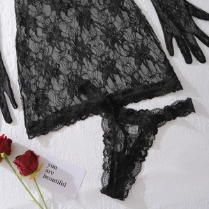 Detail of sheer black floral lace lingerie set including top, thong and matching gloves